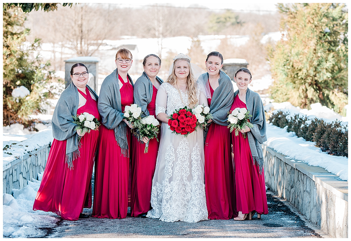 Red bridesmaid dresses; winter wedding; red rose bridal bouquet;