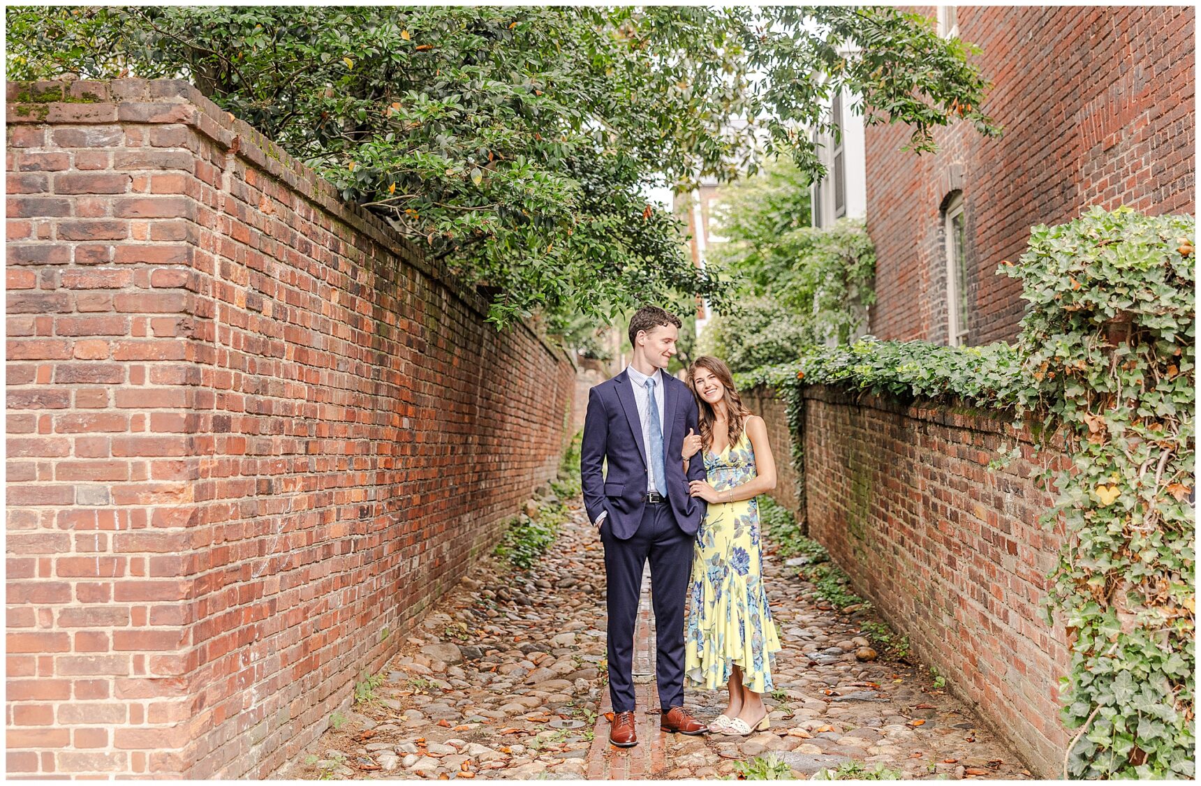 Timeless engagement photos on the cobblestone streets of Old Town Alexandria, Engagement portraits at Old Town Alexandria waterfront,Alexandria engagement photographer capturing candid moments in Old Town,Old Town Alexandria engagement photos showcasing historic charm and character,Romantic engagement photos in Downtown Alexandria featuring historic architecture