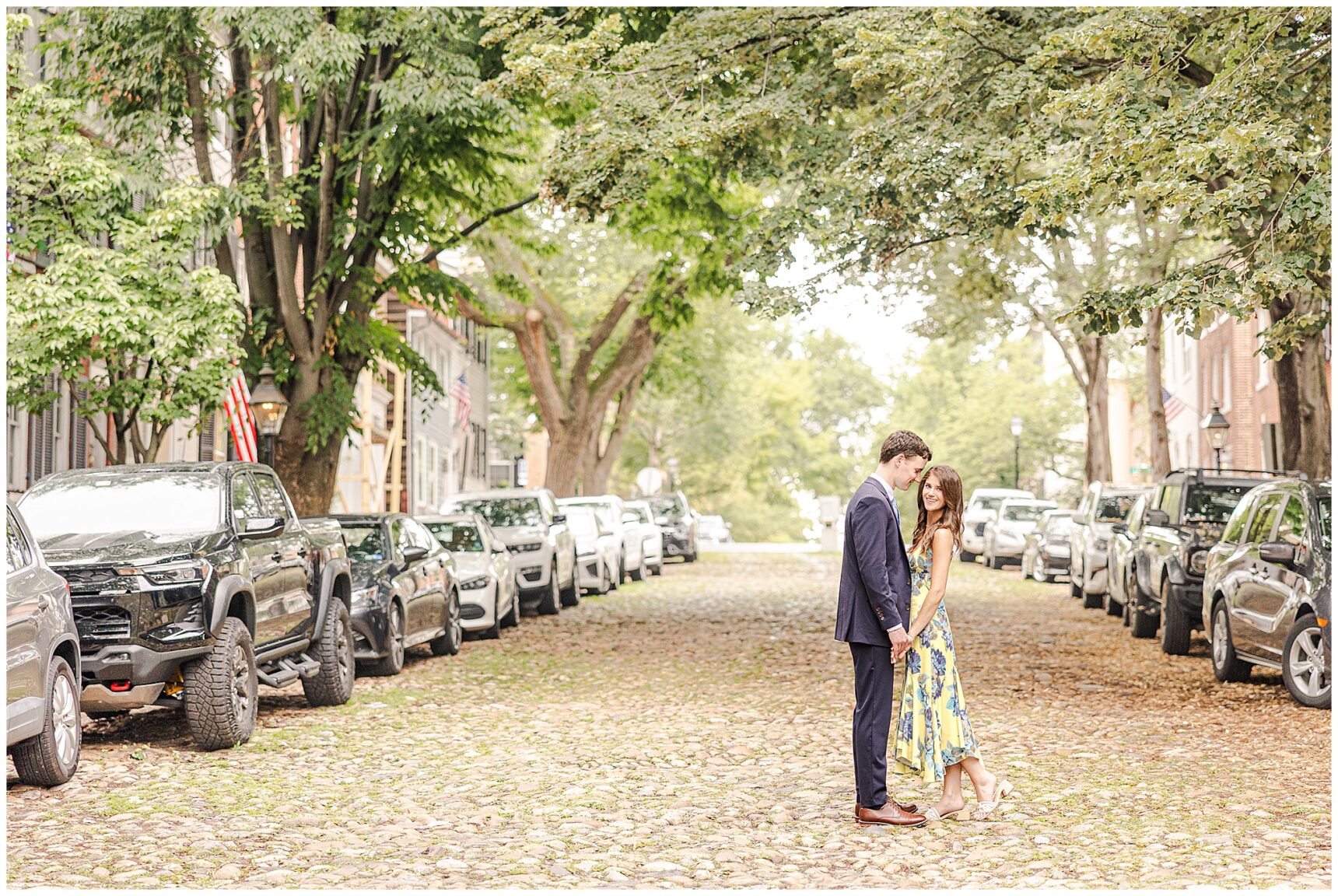 Timeless engagement photos on the cobblestone streets of Old Town Alexandria, Engagement portraits at Old Town Alexandria waterfront,Alexandria engagement photographer capturing candid moments in Old Town,Old Town Alexandria engagement photos showcasing historic charm and character,Romantic engagement photos in Downtown Alexandria featuring historic architecture, Engagement photos in Prince Street Alexandria