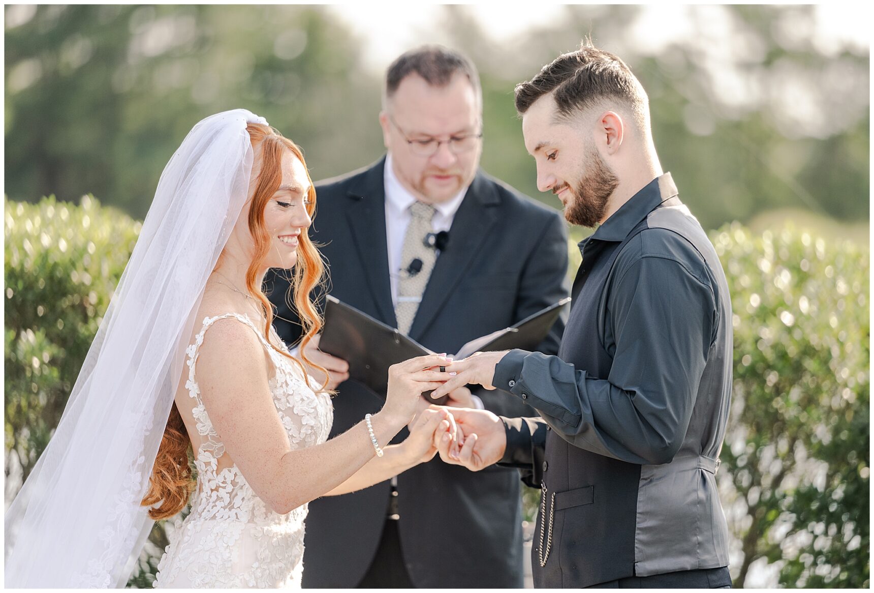 Kara and Andrew exchanging vows at their Old House Vineyards ceremony