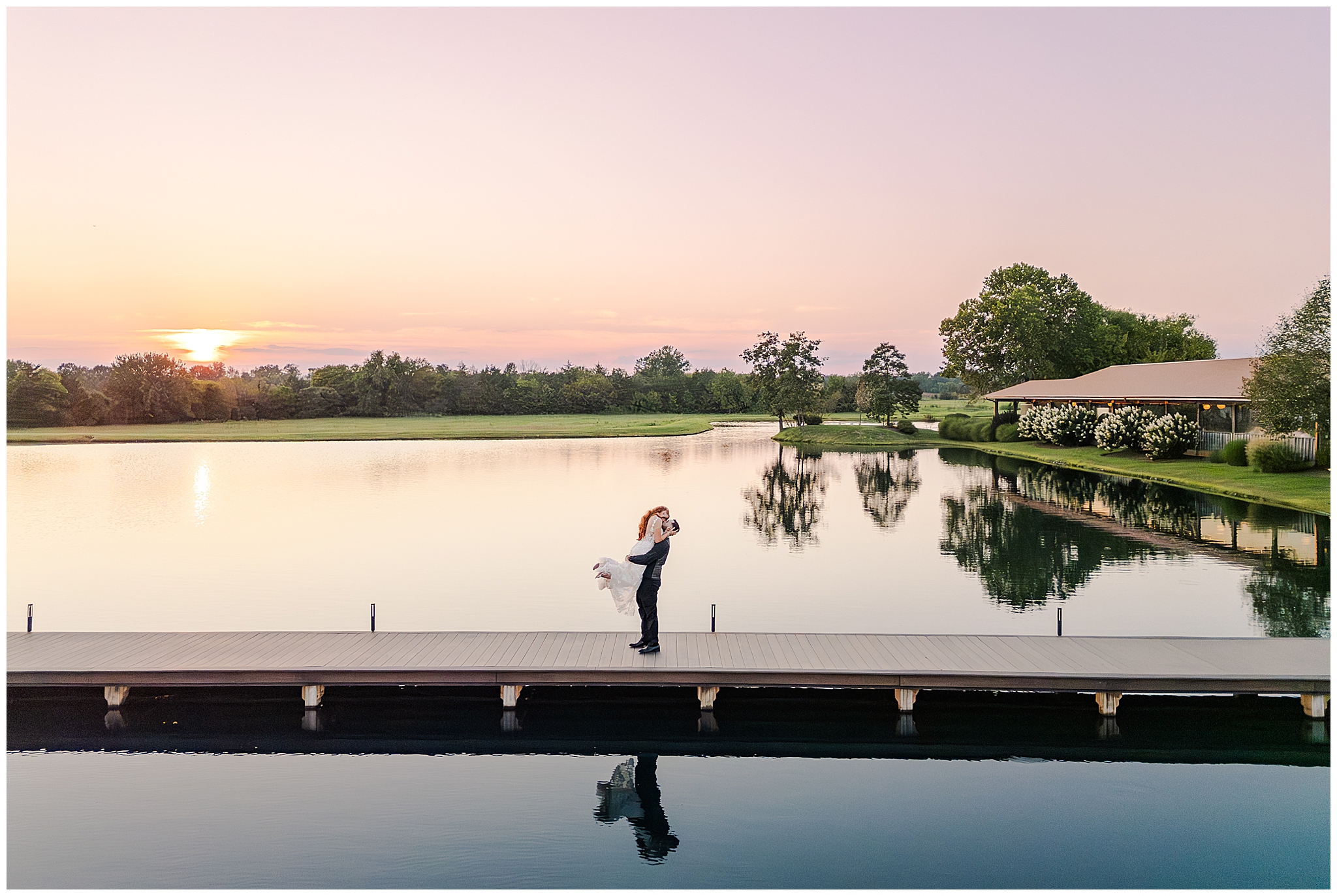 Kara and Andrew pose together as the sun sets over the beautiful vineyards at Old House Vineyards.
